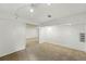 Versatile basement with open layout, neutral carpet, and ample lighting, offering customization potential at 470 S Queen St, Lakewood, CO 80226