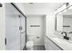 Modern bathroom features a sleek glass-enclosed shower, contemporary vanity, and stylish fixtures at 470 S Queen St, Lakewood, CO 80226