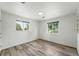 Comfortable bedroom with wood-look floors and bright natural light at 470 S Queen St, Lakewood, CO 80226