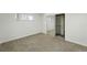 Neutral bedroom featuring carpet and a closet with mirrored doors at 470 S Queen St, Lakewood, CO 80226