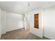 Neutral bedroom featuring a shelf on the wall, carpeting, and natural light from the window creating a relaxing atmosphere at 470 S Queen St, Lakewood, CO 80226