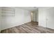 Clean bedroom featuring wood-look floors and a closet at 470 S Queen St, Lakewood, CO 80226