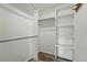 Walk-in closet featuring wood-look floors, shelves, and clothes rods at 470 S Queen St, Lakewood, CO 80226
