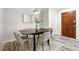 Cozy dining area featuring a modern table set and a neutral decor at 470 S Queen St, Lakewood, CO 80226