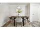 Cozy dining area featuring a modern table set and a neutral decor at 470 S Queen St, Lakewood, CO 80226