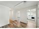 Bright laundry area with modern washer and dryer set, wood-look flooring, and ample natural light at 470 S Queen St, Lakewood, CO 80226