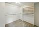 Spacious walk-in closet featuring built-in shelving and ample storage space at 470 S Queen St, Lakewood, CO 80226