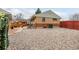 Backyard featuring a low maintenance gravel area, concrete patio, and access to the home's exterior at 7296 Quivas St, Denver, CO 80221