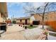 Private backyard featuring patio area, landscaped areas, and an accessory structure at 7296 Quivas St, Denver, CO 80221