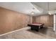 Basement featuring a red felt pool table and carpeting at 7296 Quivas St, Denver, CO 80221