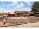 An inviting brick home featuring decorative stone landscaping, secure front door, plus a fenced yard at 7296 Quivas St, Denver, CO 80221
