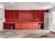 Well-organized garage with custom shelving, a refrigerator, and an abundance of storage options at 7296 Quivas St, Denver, CO 80221