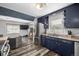 An inviting kitchen and open living area with stainless steel refrigerator and ample natural light at 7296 Quivas St, Denver, CO 80221