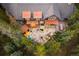 Stunning aerial view of the house highlighting the patio, hot tub, fire pit and mature landscaping; a true outdoor retreat at 215 Royal Tiger Rd, Breckenridge, CO 80424