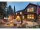 Inviting backyard featuring a stone patio, a fire pit, outdoor furniture, and an exterior view of the home at 215 Royal Tiger Rd, Breckenridge, CO 80424