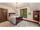A bright bedroom featuring a large window and a chandelier at 215 Royal Tiger Rd, Breckenridge, CO 80424