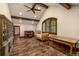 Bright bedroom featuring a window view, vaulted ceiling with wood beams, a writing desk, and hardwood floors at 215 Royal Tiger Rd, Breckenridge, CO 80424