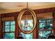 Close up of a circular chandelier with windows in the background of the dining room at 215 Royal Tiger Rd, Breckenridge, CO 80424