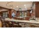 Spacious kitchen features custom cabinets, stone countertops, and stainless steel appliances at 215 Royal Tiger Rd, Breckenridge, CO 80424
