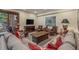 Comfortable seating area with a TV, lots of seating, and views of the backyard at 215 Royal Tiger Rd, Breckenridge, CO 80424