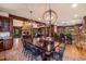 Spacious living room with decorative lighting, hardwood floors, and views of the dining and kitchen areas at 215 Royal Tiger Rd, Breckenridge, CO 80424