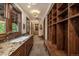 Spacious mudroom featuring custom built-in shelving, bench seating, granite counters, and natural light throughout at 215 Royal Tiger Rd, Breckenridge, CO 80424