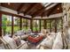 Comfortable sunroom with a wood ceiling, cushioned furniture, and lots of natural light at 215 Royal Tiger Rd, Breckenridge, CO 80424