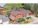 Aerial view of a brick home, showcasing its landscaped yard and neighborhood setting at 6919 S Valentia St, Centennial, CO 80112