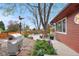 Backyard with a stainless steel grill, a gazebo, and brick-lined pathways at 6919 S Valentia St, Centennial, CO 80112