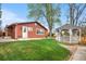 Charming home with a well-manicured lawn and a gazebo in the backyard at 6919 S Valentia St, Centennial, CO 80112
