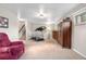 Finished basement with treadmill, carpet flooring, and traditional decor at 6919 S Valentia St, Centennial, CO 80112