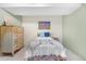 Neutral bedroom featuring a single bed with colorful patterned accents at 6919 S Valentia St, Centennial, CO 80112