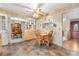 Nostalgic kitchen with classic finishes, wood cabinets, and an adjacent eating area at 6919 S Valentia St, Centennial, CO 80112