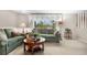 Cozy living room featuring comfortable seating, and soft natural light at 6919 S Valentia St, Centennial, CO 80112