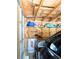 Garage interior with car and storage shelving at 1160 S Monaco Pkwy # 6, Denver, CO 80224