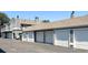 View of garages, showing the building's architecture and unit access at 1160 S Monaco Pkwy # 6, Denver, CO 80224