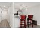 Kitchen area offers seating, stainless steel appliances, and lots of counter space at 1160 S Monaco Pkwy # 6, Denver, CO 80224