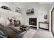 Spacious living room features a fireplace, vaulted ceiling, and loft overlooking a modern open kitchen at 1160 S Monaco Pkwy # 6, Denver, CO 80224
