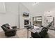 Bright living room boasts a fireplace and sliding doors leading to a private outdoor patio at 1160 S Monaco Pkwy # 6, Denver, CO 80224