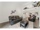 Bright living room featuring a kitchen view, modern furnishings, loft, and stylish decor at 1160 S Monaco Pkwy # 6, Denver, CO 80224