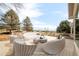 Stylishly staged back deck with modern furniture, perfect for outdoor gatherings and relaxation at 14850 Akron St, Brighton, CO 80602
