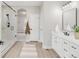Modern bathroom featuring a glass-enclosed shower, white vanity, and neutral color palette at 14850 Akron St, Brighton, CO 80602