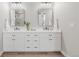 Spacious bathroom with double vanity, quartz counters, contemporary mirrors, and modern fixtures at 14850 Akron St, Brighton, CO 80602