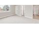 Large, bright bedroom with plush carpeting, white trim, and lots of natural light at 14850 Akron St, Brighton, CO 80602