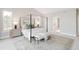Large bedroom with natural light and ample space, featuring a stylish canopy bed at 14850 Akron St, Brighton, CO 80602
