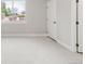 Bright, carpeted bedroom with natural light coming through the window, creating a serene space at 14850 Akron St, Brighton, CO 80602