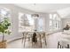 Bright dining area with large windows and stylish decor overlooking the deck at 14850 Akron St, Brighton, CO 80602