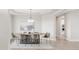 Elegant dining room with modern chandelier and stylish decor creates a sophisticated ambiance at 14850 Akron St, Brighton, CO 80602