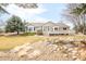 Charming single Gathering home with a well-maintained lawn, mature trees, and a serene backyard pond at 14850 Akron St, Brighton, CO 80602