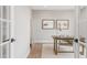 Bright office space features a desk, neutral decor, and a serene view from the window at 14850 Akron St, Brighton, CO 80602